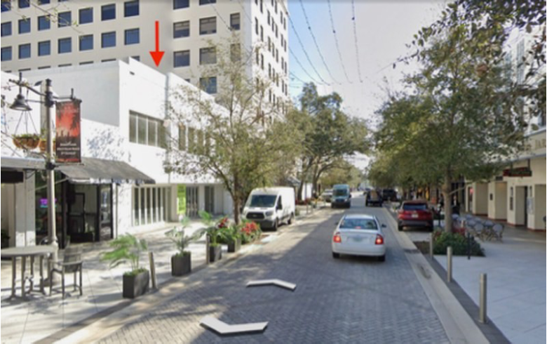City street with vehicles and trees