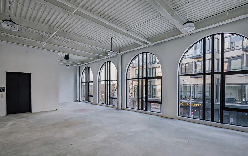 Spacious room with large arched windows