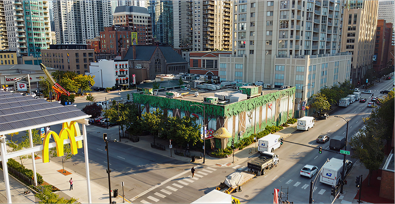 Green-roofed building in cityscape