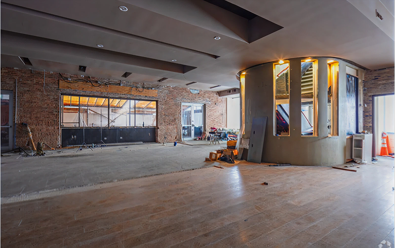 Empty room with exposed brick walls