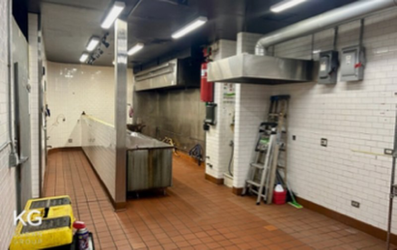 Industrial kitchen with tiled walls