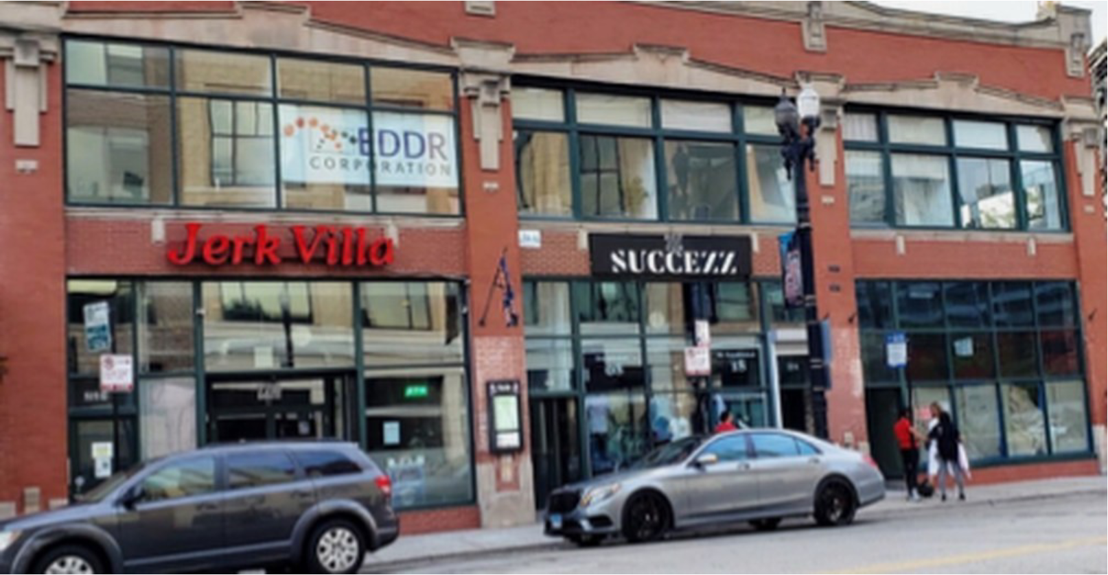 Street view of red brick storefronts