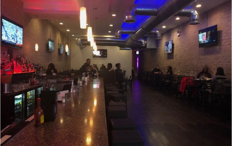 Modern bar interior with patrons seated