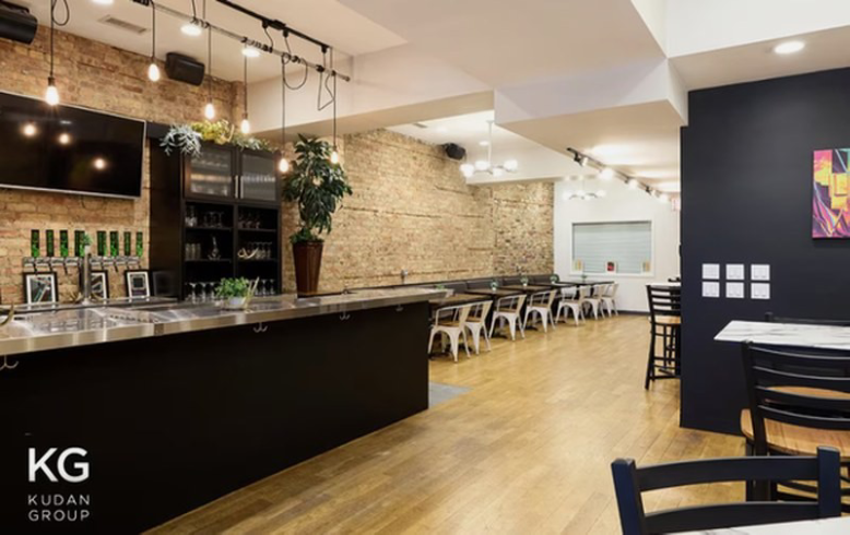 Contemporary dining area with exposed brick walls