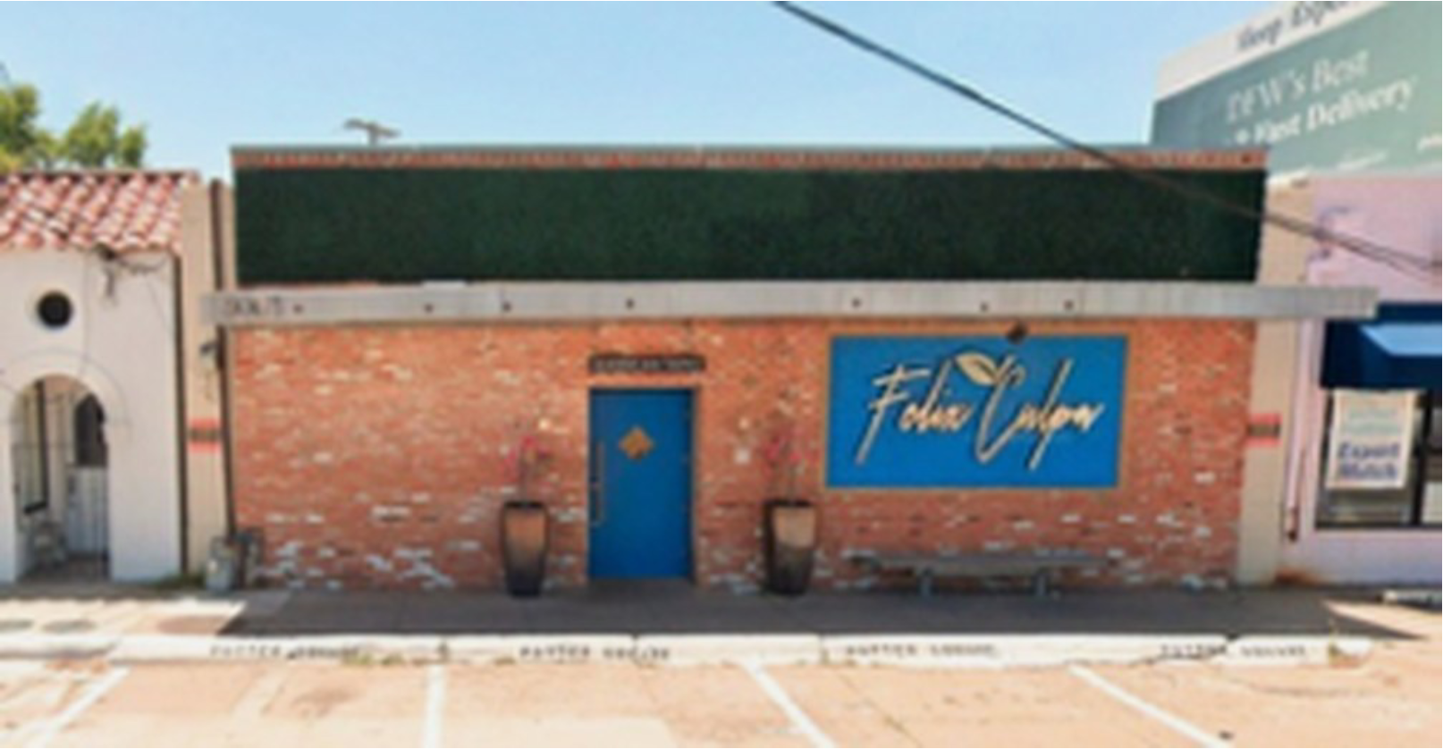 Urban building exterior with decorative sign.