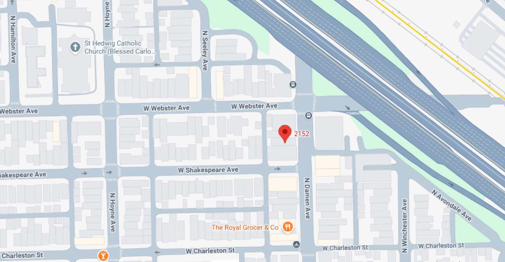 Map pin at urban neighborhood near train tracks