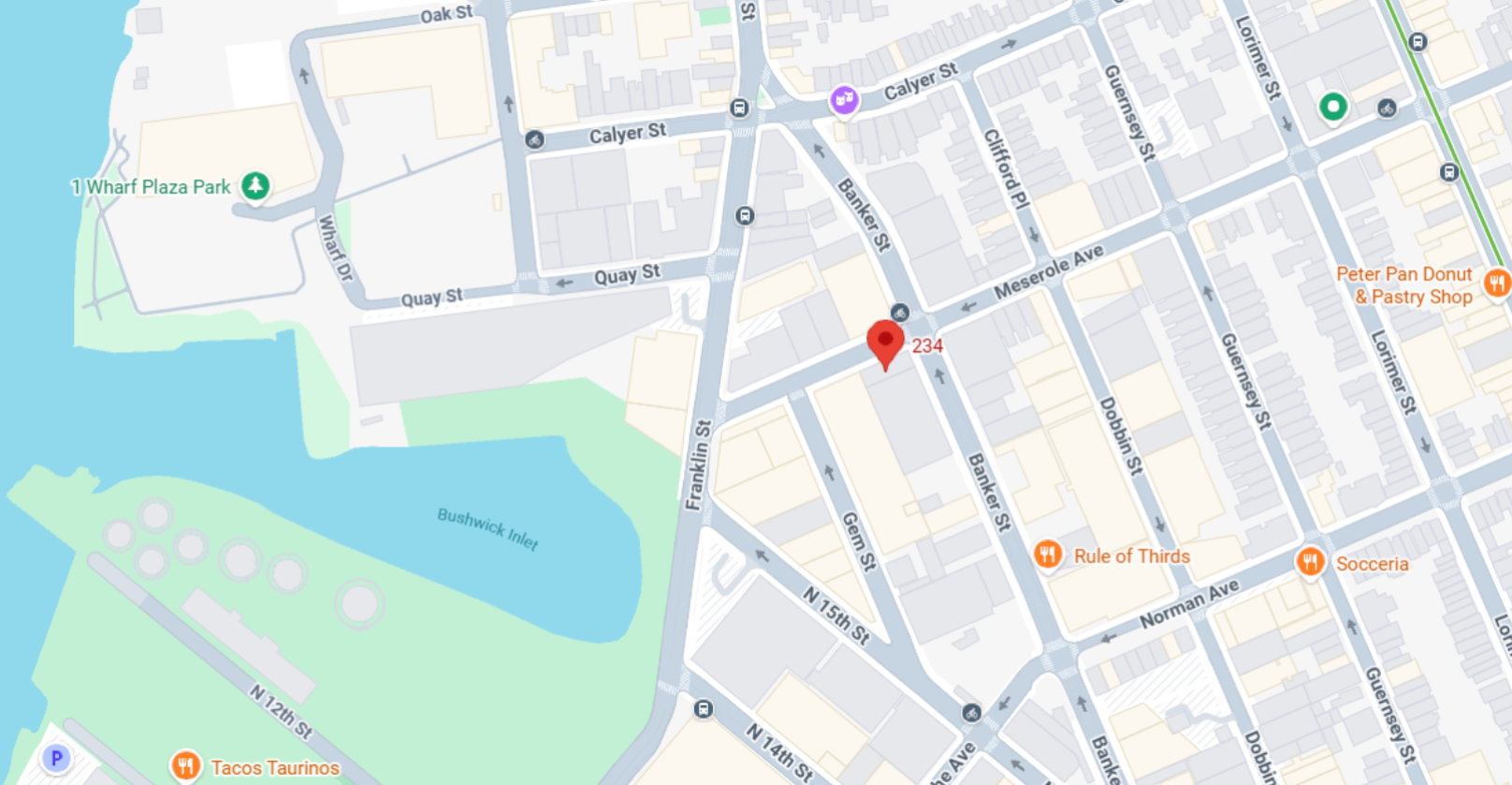 Map with red location pin near waterfront park