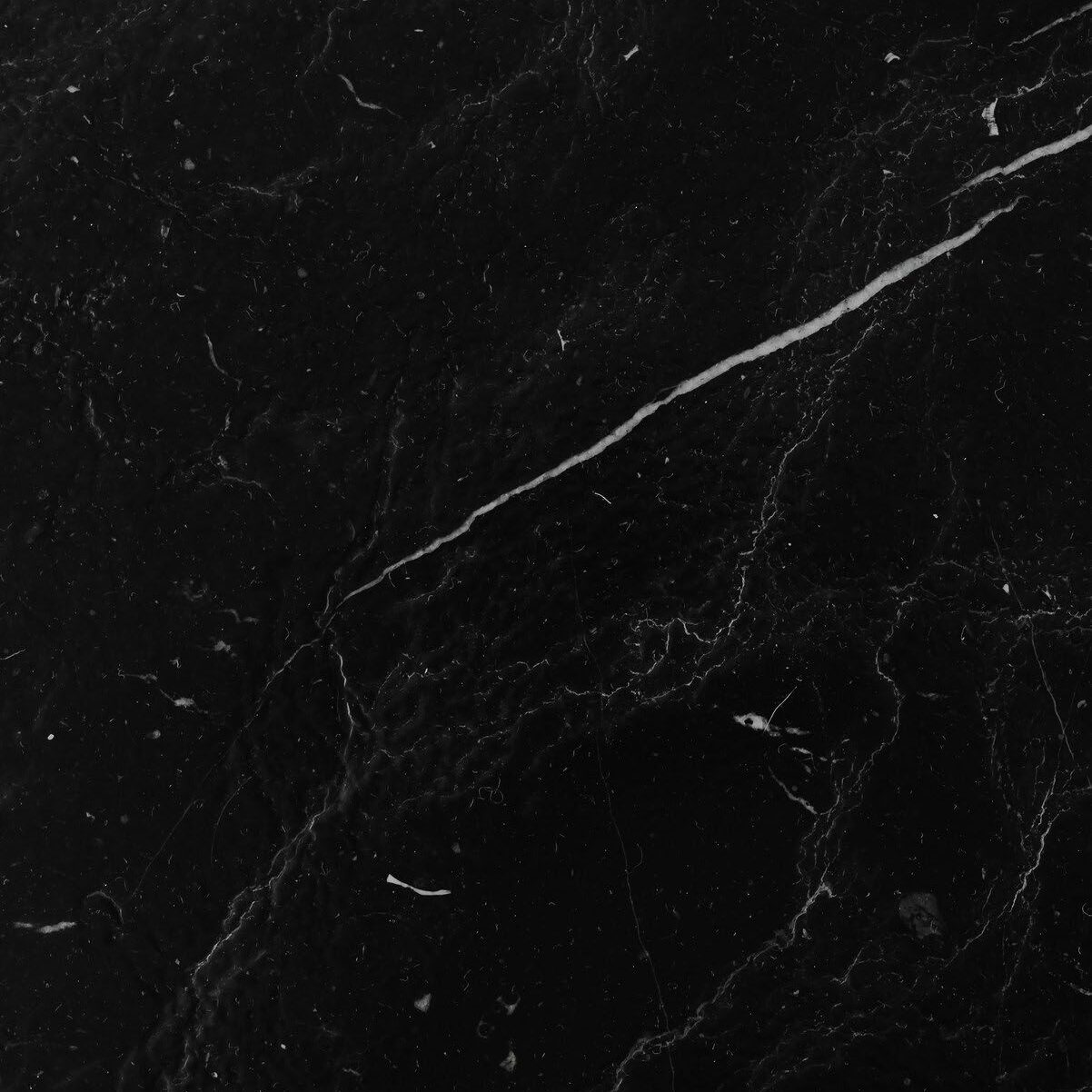 Black marble with white veining pattern.